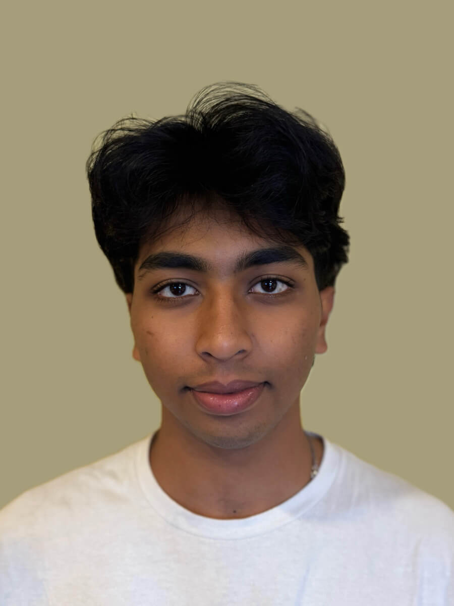 Varun Kota's photo is a his headshot. He's looking center and wearing a white shirt.