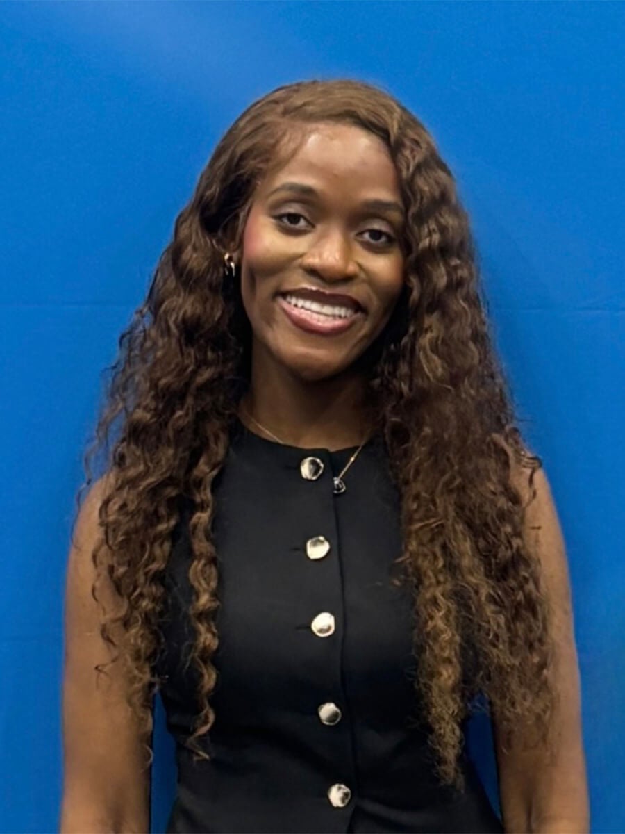 Headshot of student wearing black dress 