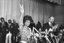 Black and white image of Shirley Chisholm giving a speech