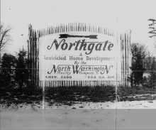 Old photograph of Northgate housing development sign, labeling it a "restricted home development"