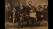 Screenshot from "Arab Indianapolis" Youtube video of a black and white photo of a family