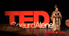 image of Native American speaker at a TED talk