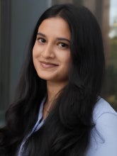 headshot of Divya Bhat