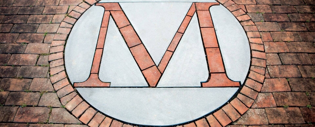 M in Circle Brick