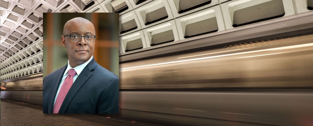 David Mussington headshot over background of fast DC metro