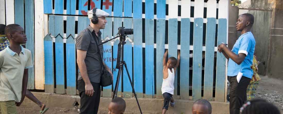 Evan interviews Ako Essan Emile in Abidjan for USAID’s storytelling hub. / Kendra Helmer, USAID