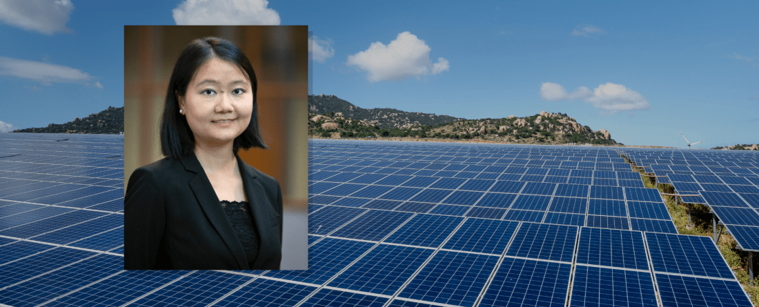 Headshot of Qiu in front of an image of solar panels 