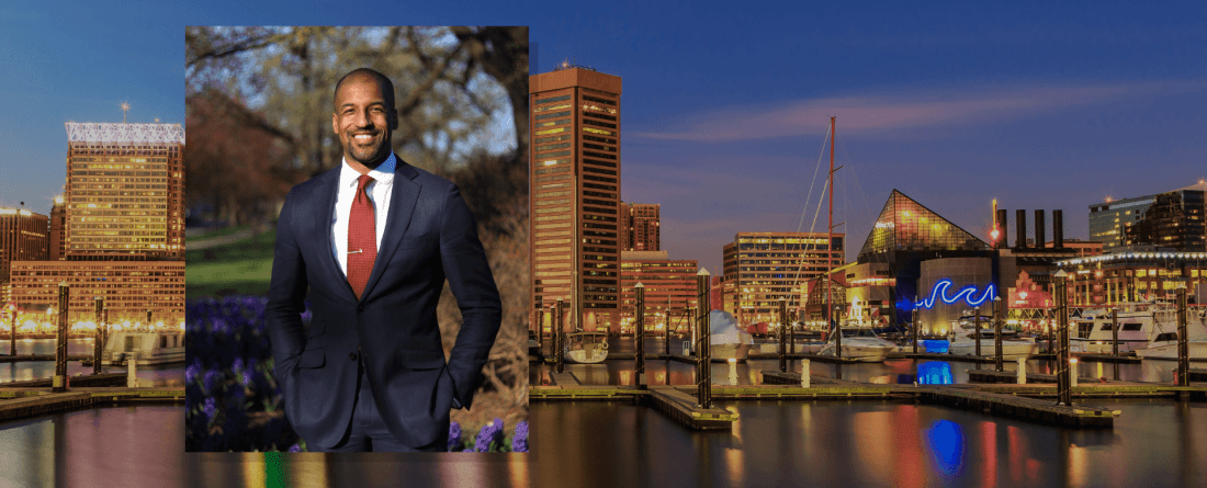 Mark Conway headshot placed over background of Baltimore cityscape at night