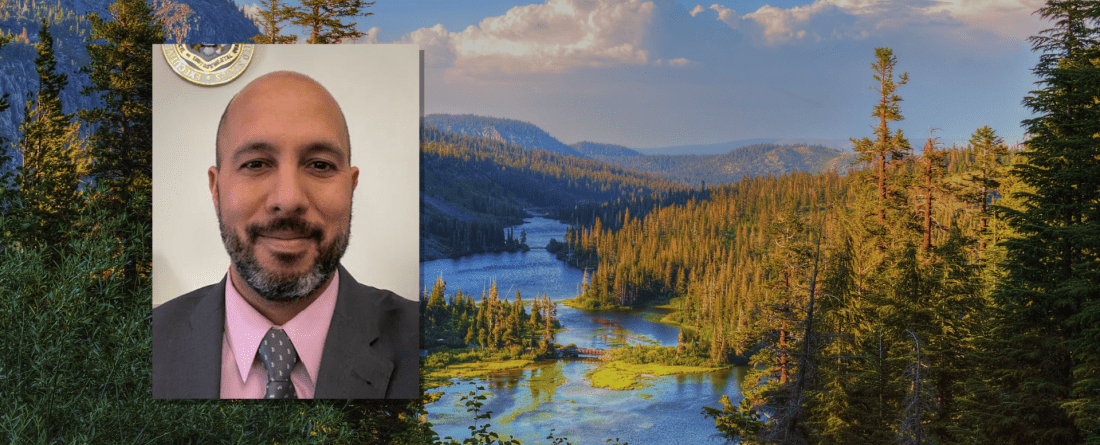 Headshot of Jomar Maldonado in front of natural landscape