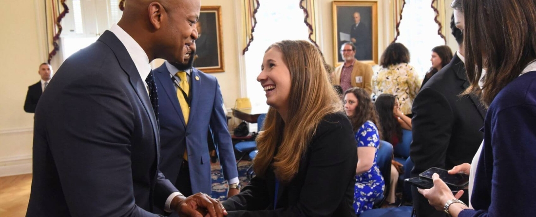 Gov. Wes Moore shaking hands with Megan Condon t the Maryland State House in Annapolis