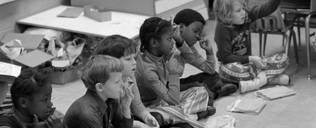 image of Black and white first-graders attending class together in Charlotte, N.C., in 1973.