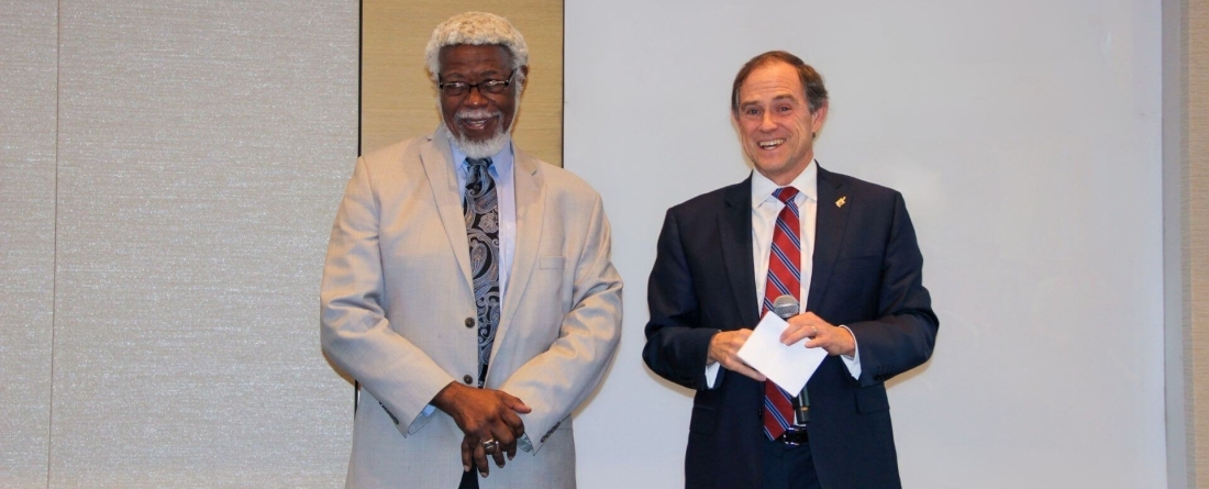 Professor Sylvester James Gates stands woth Policy School Dean Robert C. Orr