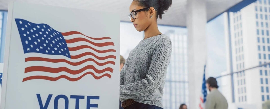 Woman standing at a voting booth