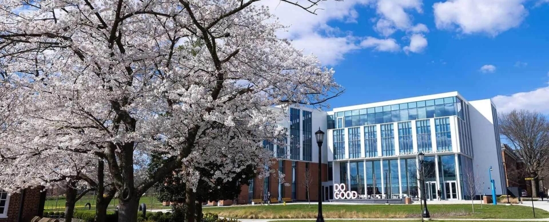 image of Thurgood Marshall Hall with cherry blossoms in the foreground