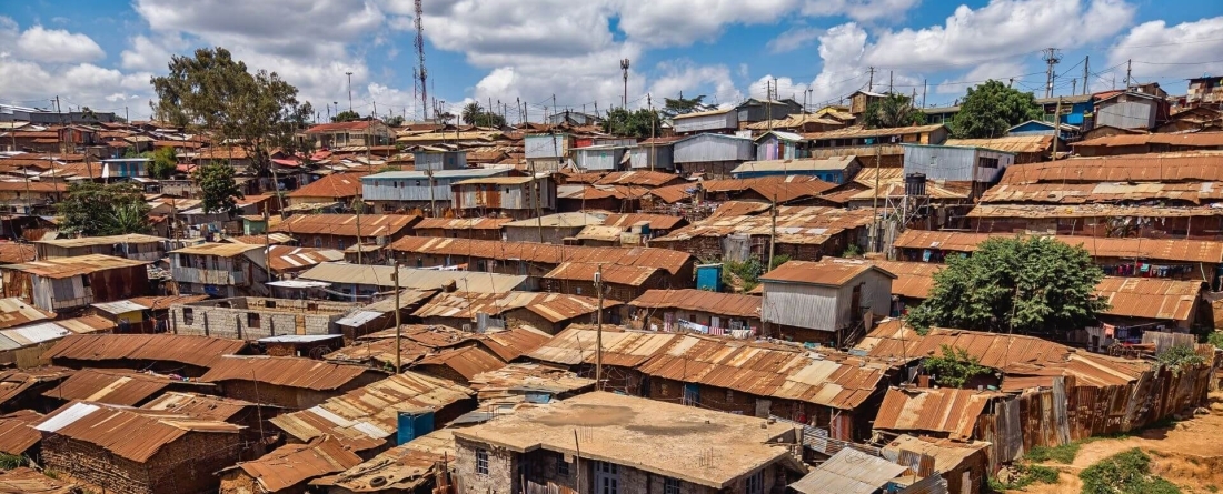 image of dilapidated houses very close together on a hillside on a sunny day