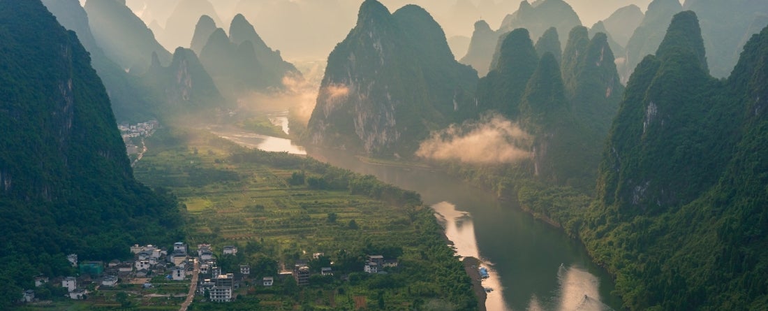 A foggy landscape of China mountains at dawn.